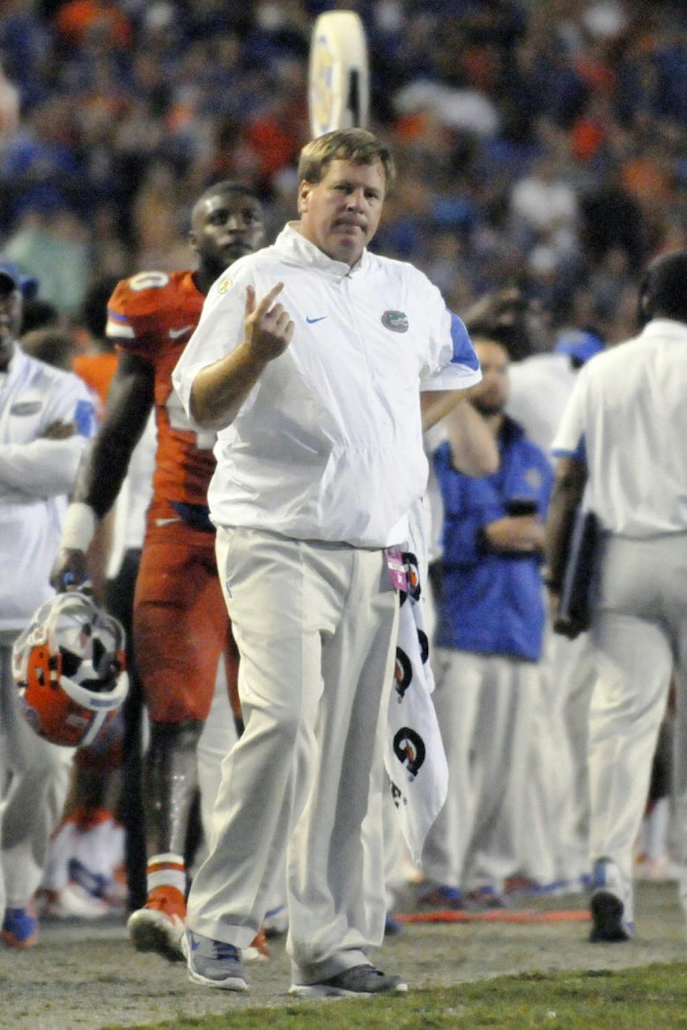 <p>UF coach Jim McElwain stands on the sidelines during Florida's 31-24 win against East Carolina on Sept. 12, 2015, at Ben Hill Griffin Stadium.</p>