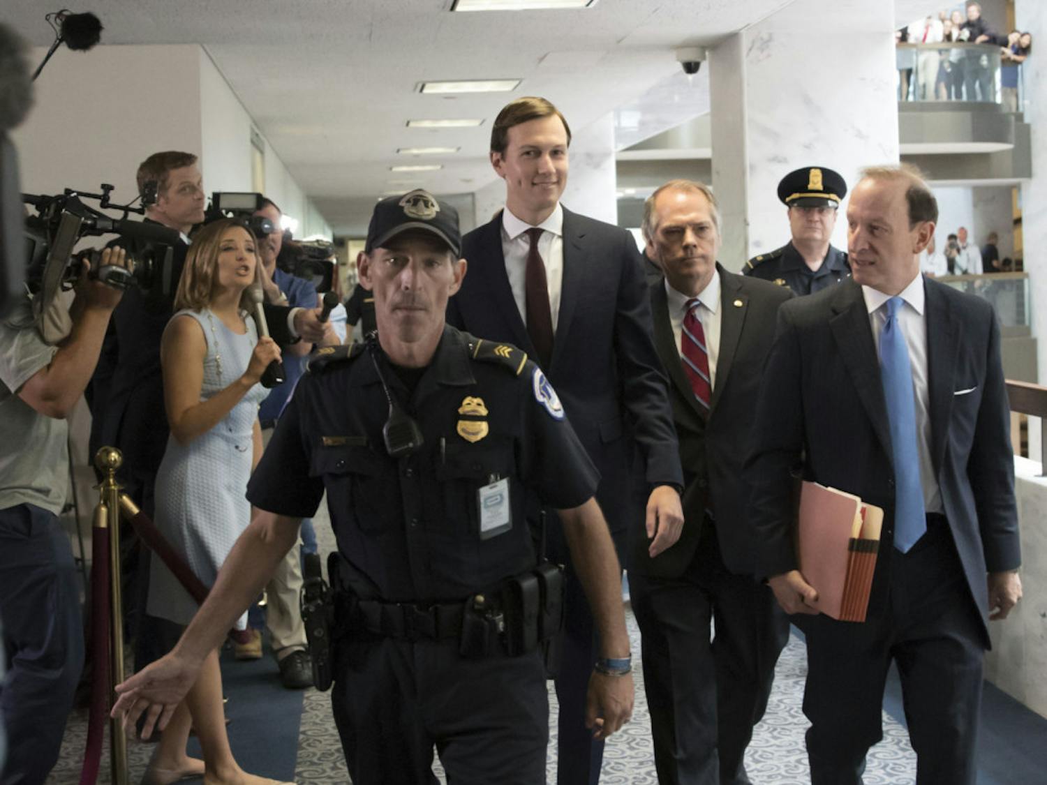 White House senior adviser Jared Kushner, center, accompanied by his attorney Abbe Lowell, right, arrives on Capitol Hill in Washington., Monday, July 24, 2017, to meet behind closed doors before the Senate Intelligence Committee on the investigation into possible collusion between Russian officials and the Trump campaign. (AP Photo/J. Scott Applewhite