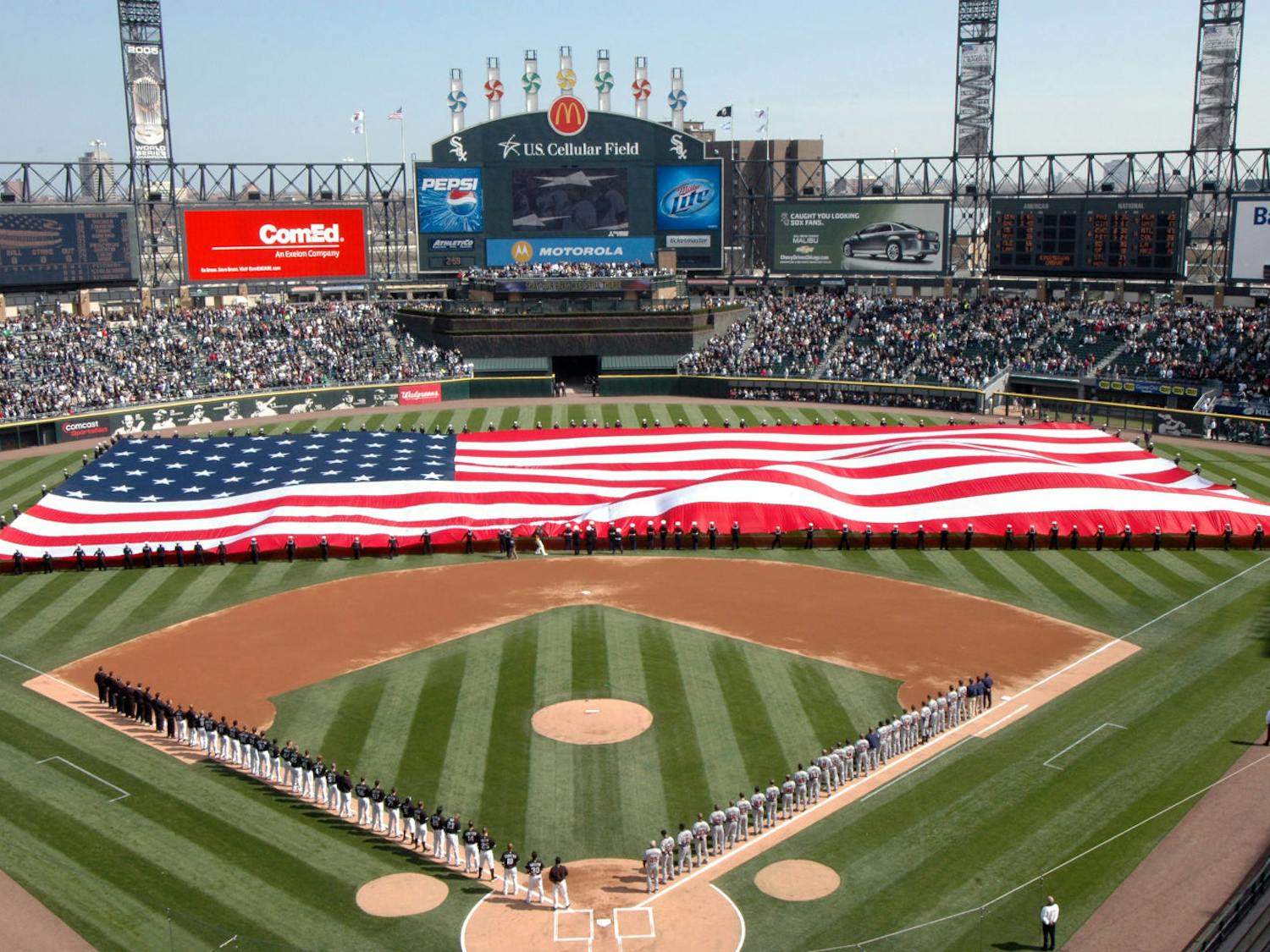 More than 100 U.S. Sailors from Navy Region Midwest, Navy Recruiting Chicago and Naval Station Great Lakes hold an American Flag during the National Anthem at opening day ceremonies for the Chicago White Sox Major League Baseball team at U.S. Cellular Field, Chicago, Ill., April 7, 2008. Great Lakes Sailors have participated in the White Sox opening day for the past six years. (U.S. Navy photo by Scott A. Thornbloom/Released)