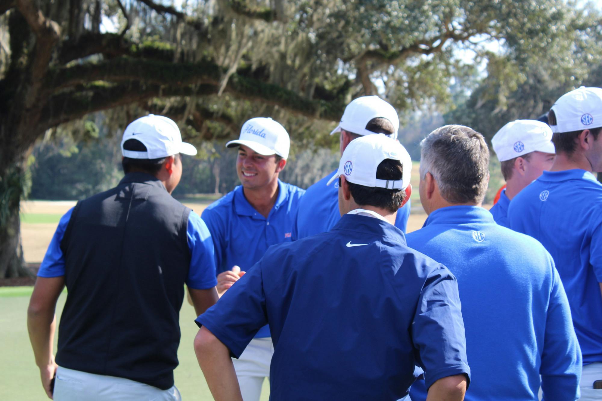 Fred Biondi celebrates with his team after draining a putt on the final hole of the Vystar Gators Invitational at the Mark Bostick Golf Course Sunday. The redshirt junior from São Paulo, Brazil finished 14-under to win the tournament with his individual score while contributing to Florida’s winning team score as well.