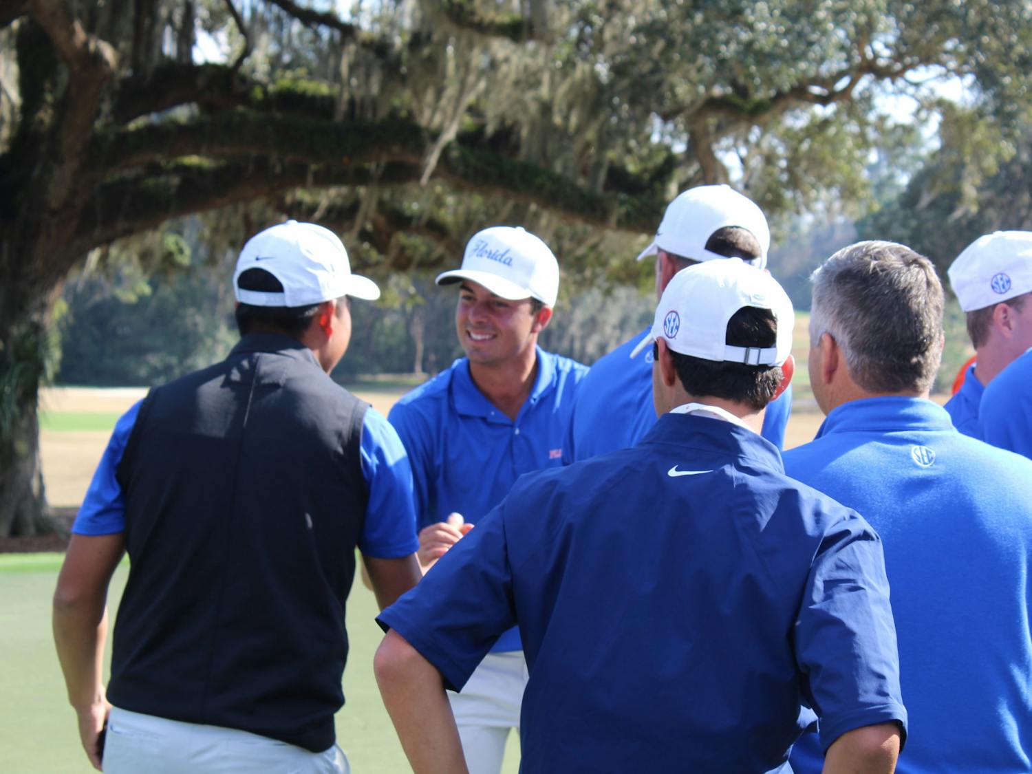 Fred Biondi celebrates with his team after draining a putt on the final hole of the Vystar Gators Invitational at the Mark Bostick Golf Course Sunday. The redshirt junior from São Paulo, Brazil finished 14-under to win the tournament with his individual score while contributing to Florida’s winning team score as well.
