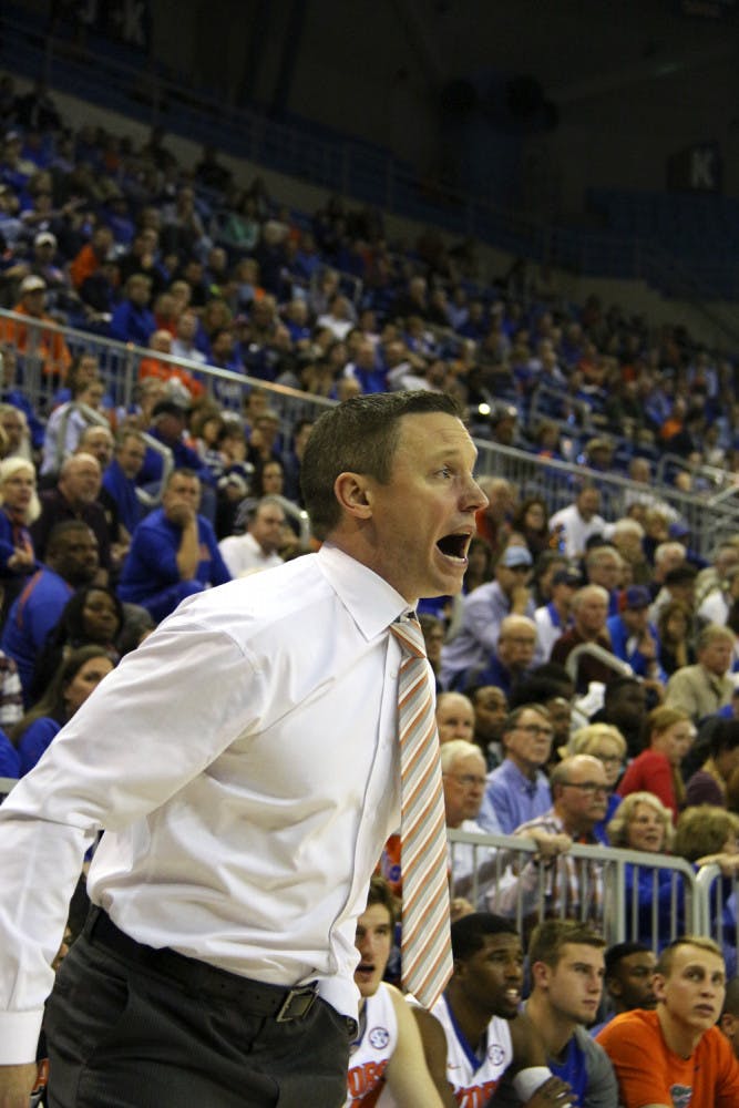 Florida coach Mike White calls out a play from the sideline during Florida's 77-72 win over Ole Miss on Feb. 9, 2016, in the O'Connell Center. 