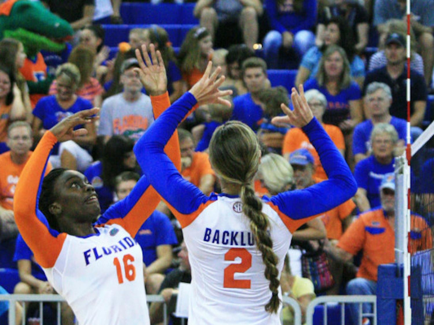 Simone Antwi (16) receives a pass from Dana Backlund (2) during UF’s 3-0 win against Jacksonville on Sept. 7, 2012, in the Stephen C. O'Connell Center. 