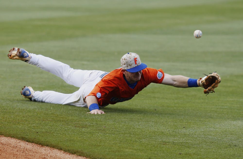 Florida's Deacon Liput dives for the ball and misses it in the seventh inning against Texas A&amp;M in a Southeastern Conference NCAA college baseball championship game at the Hoover Met, Sunday, May 29, 2016, in Hoover, Ala. Texas A&amp;M won 12-5. (AP Photo/Brynn Anderson)