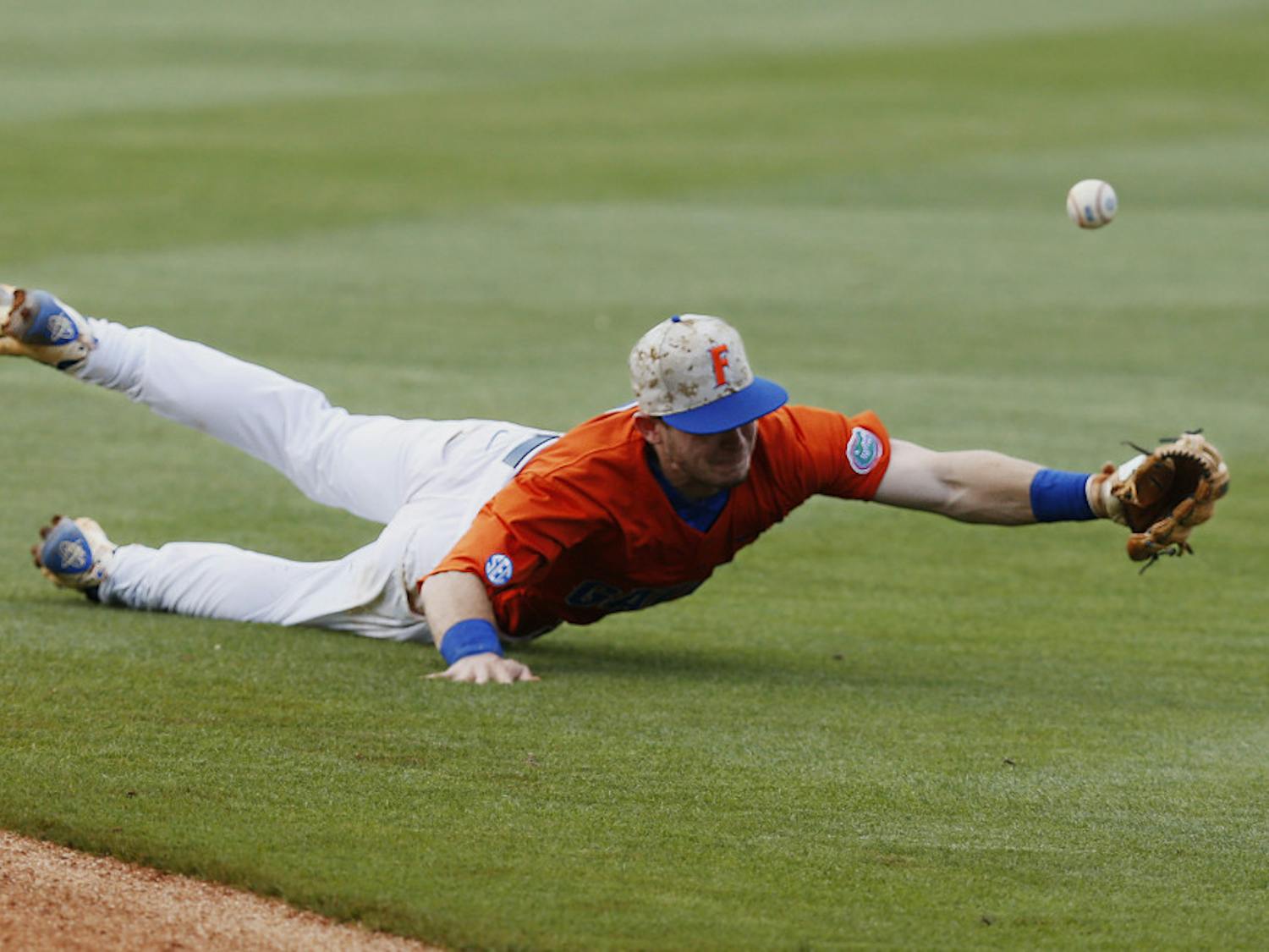 Florida's Deacon Liput dives for the ball and misses it in the seventh inning against Texas A&M in a Southeastern Conference NCAA college baseball championship game at the Hoover Met, Sunday, May 29, 2016, in Hoover, Ala. Texas A&M won 12-5. (AP Photo/Brynn Anderson)