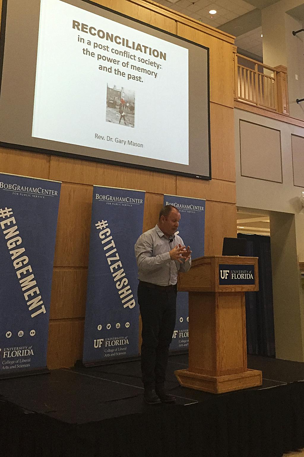 Reverend Gary Mason speaks to about 60 people on Tuesday evening at Bob Graham Center for Public Service in Pugh Hall. The Irish minister talked about the conflicts and terrorism in Ireland and how it has affected those who live there.