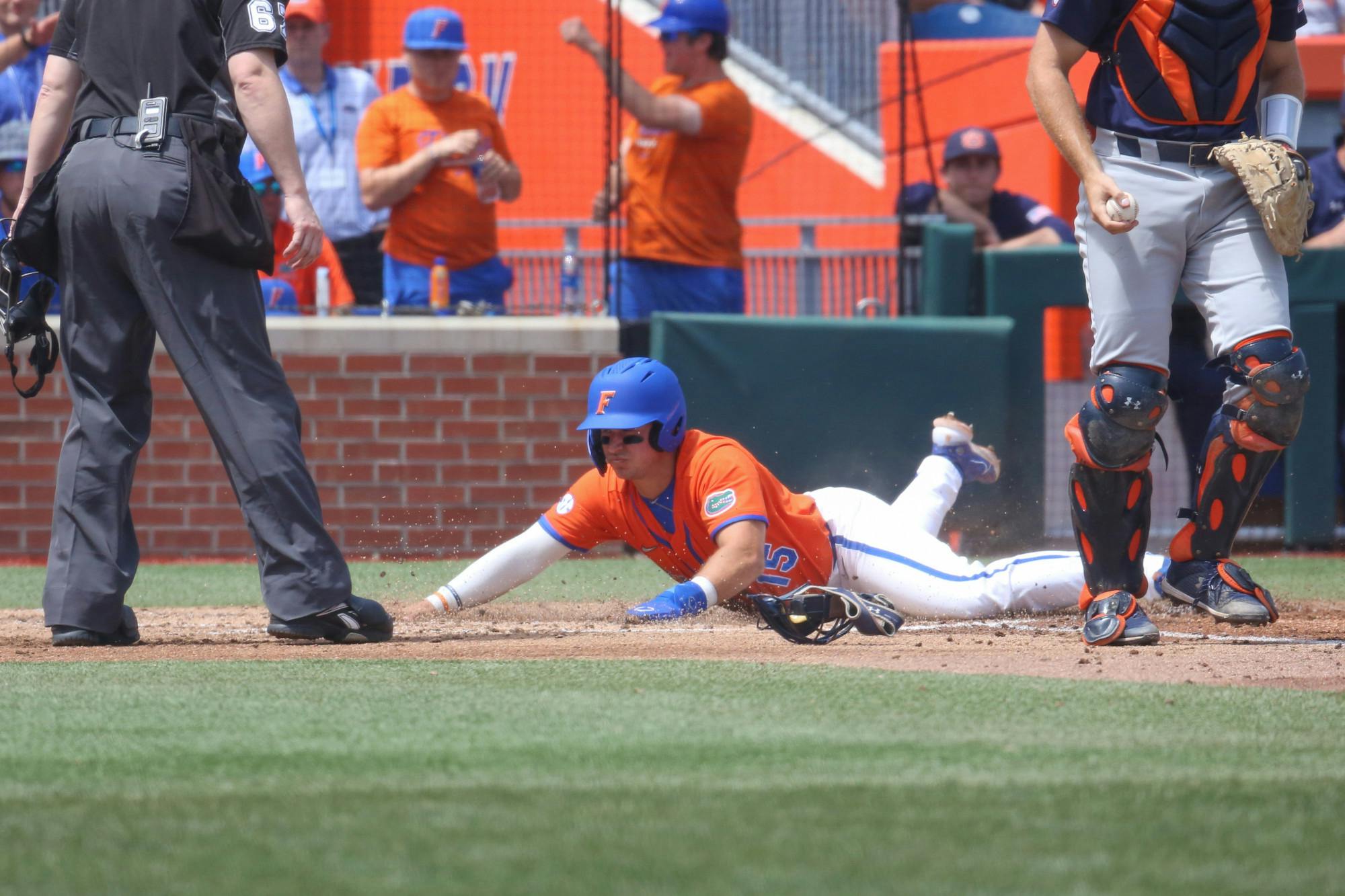 Florida first baseman BT Riopelle slides into home plate in the Gators' 17-8 victory against the Auburn Tigers Sunday, April 2, 2023. 