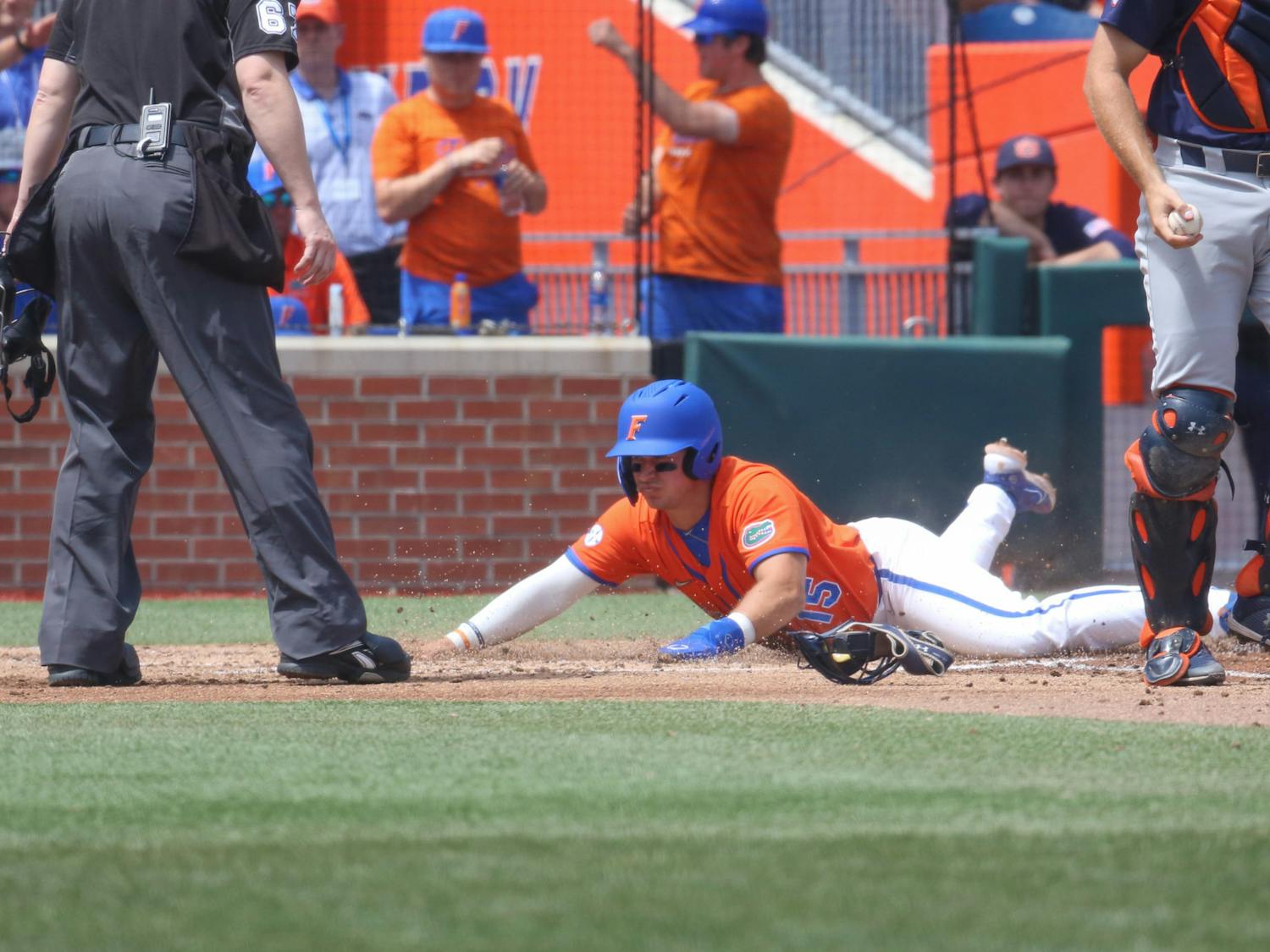 Florida first baseman BT Riopelle slides into home plate in the Gators' 17-8 victory against the Auburn Tigers Sunday, April 2, 2023. 