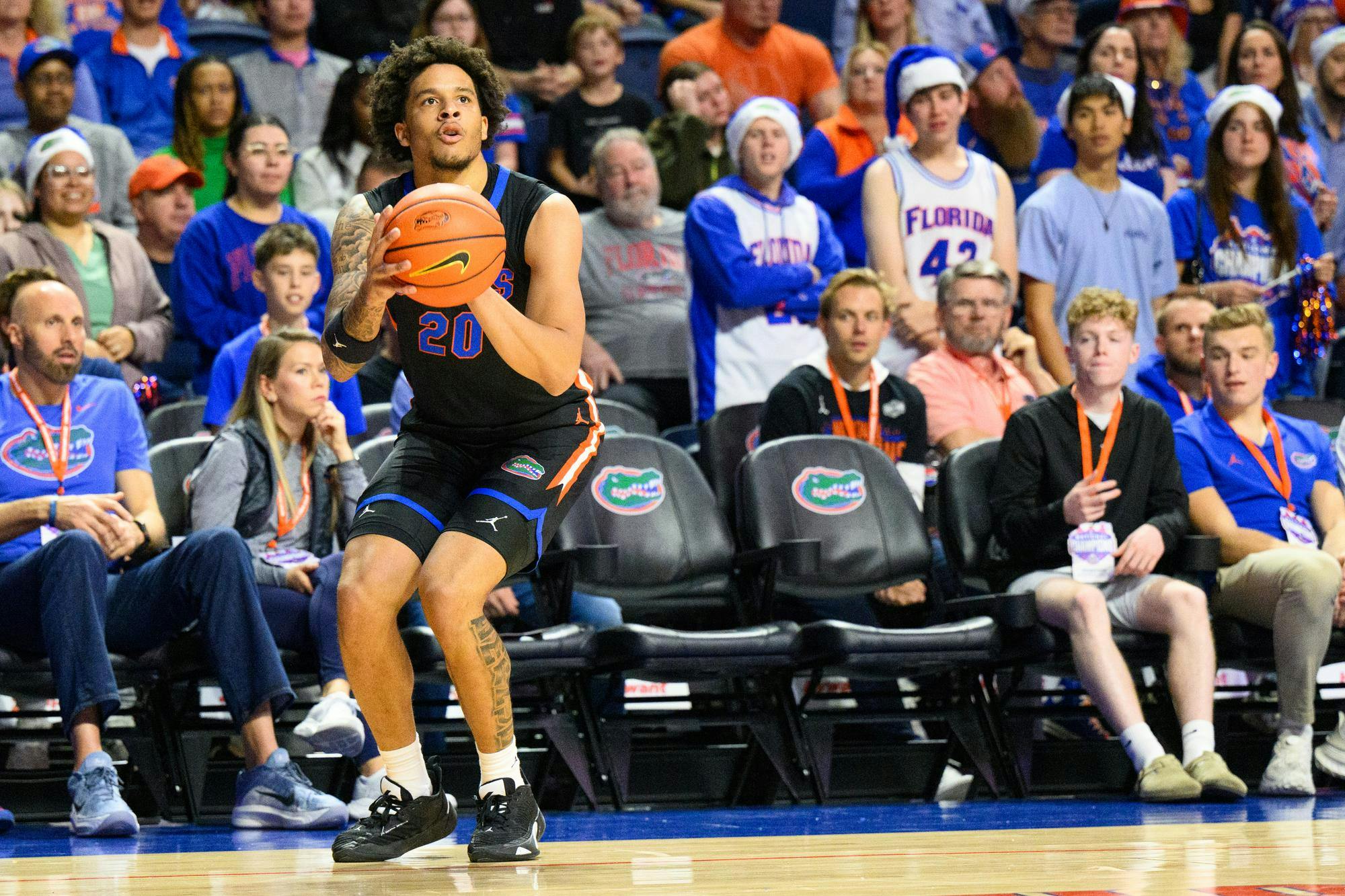 Florida guard Isaiah Brown (20) shoots during the first half of an NCAA college basketball game against Saint Francis, Wednesday, Dec. 17, 2025, in Gainesville, Fla.