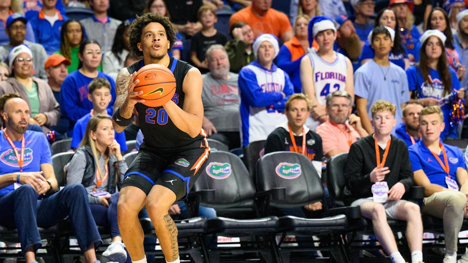 Florida guard Isaiah Brown (20) shoots during the first half of an NCAA college basketball game against Saint Francis, Wednesday, Dec. 17, 2025, in Gainesville, Fla.