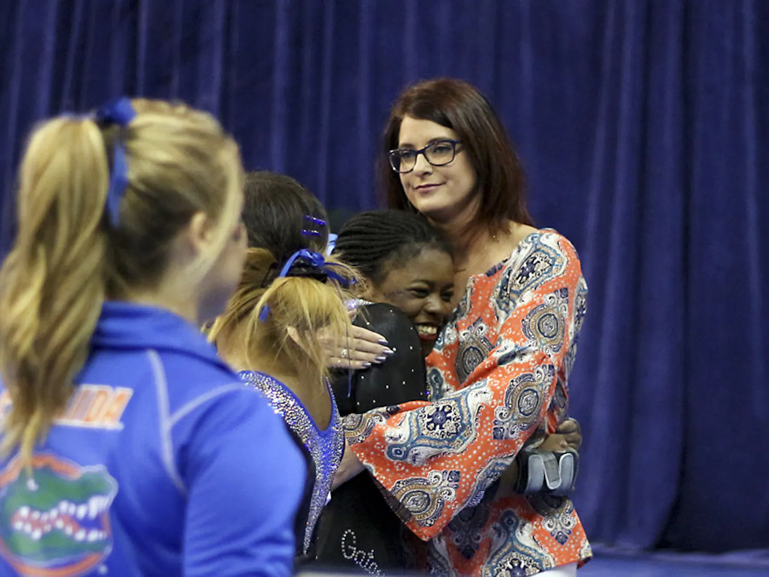 Alicia Boren hugs coach Jenny Rowland during Florida's win over North Carolina on March 11, 2016, in the O'Connell Center.