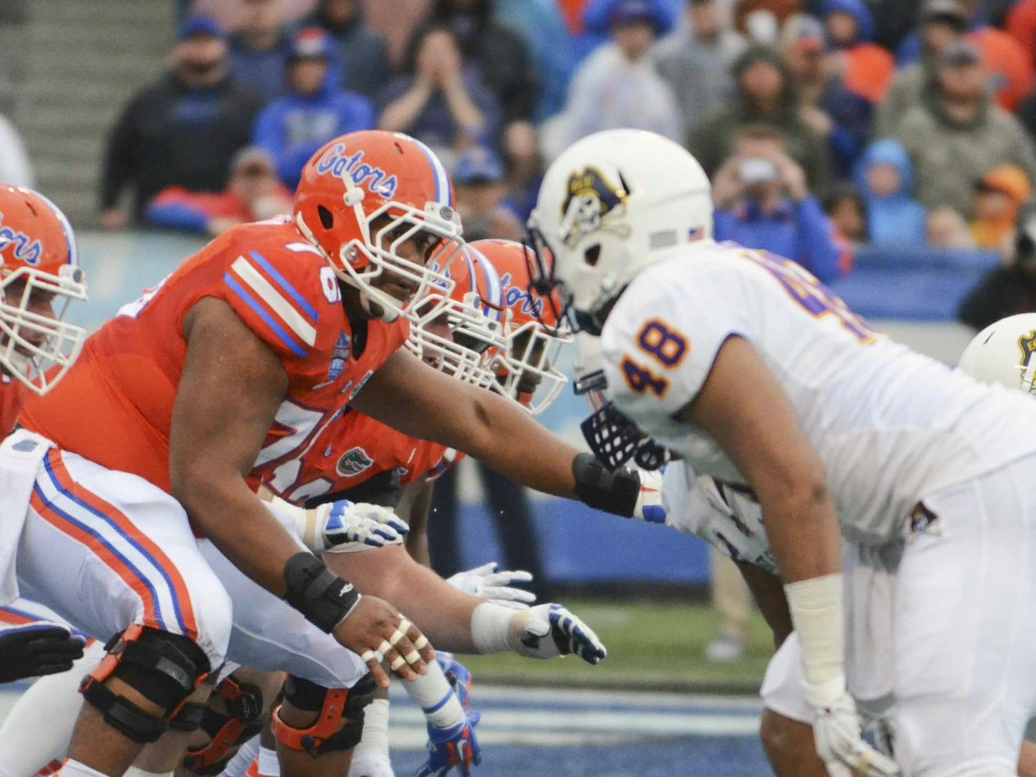 Max Garcia snaps the ball during Florida's 28-20 win against East Carolina in the Birmingham Bowl on Saturday at Legion Field.