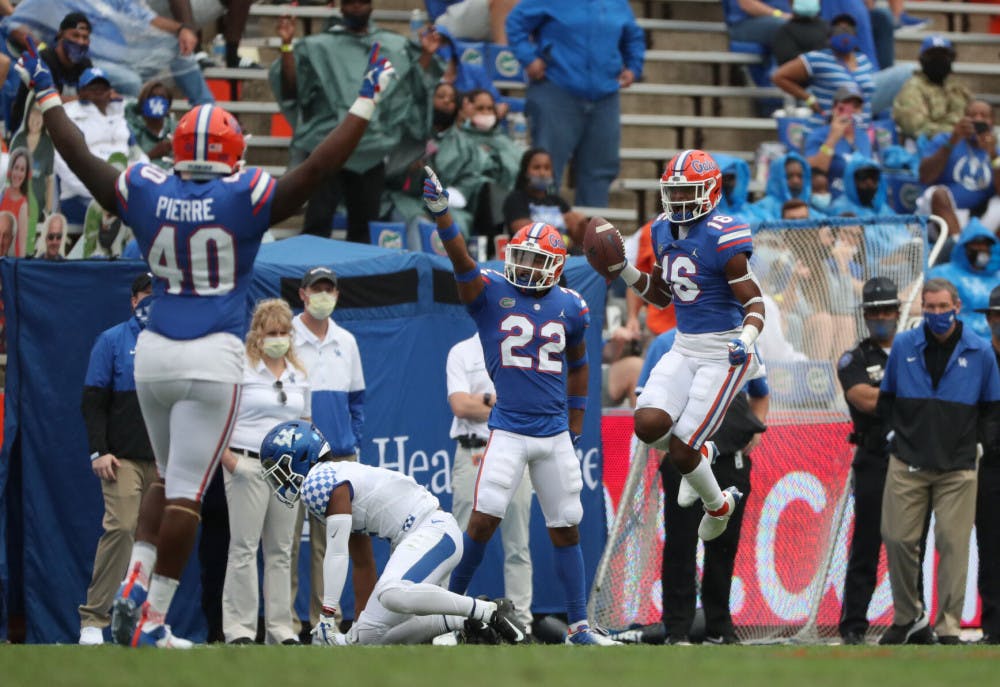 <p>Tre’Vez Johnson (16), Jesiah Pierre (40) and Rashad Torrence II (22) celebrate in the Gators game against Kentucky in The Swamp on Nov. 28. (Photo Courtesy of Courtney Culbreath/UAA).</p>