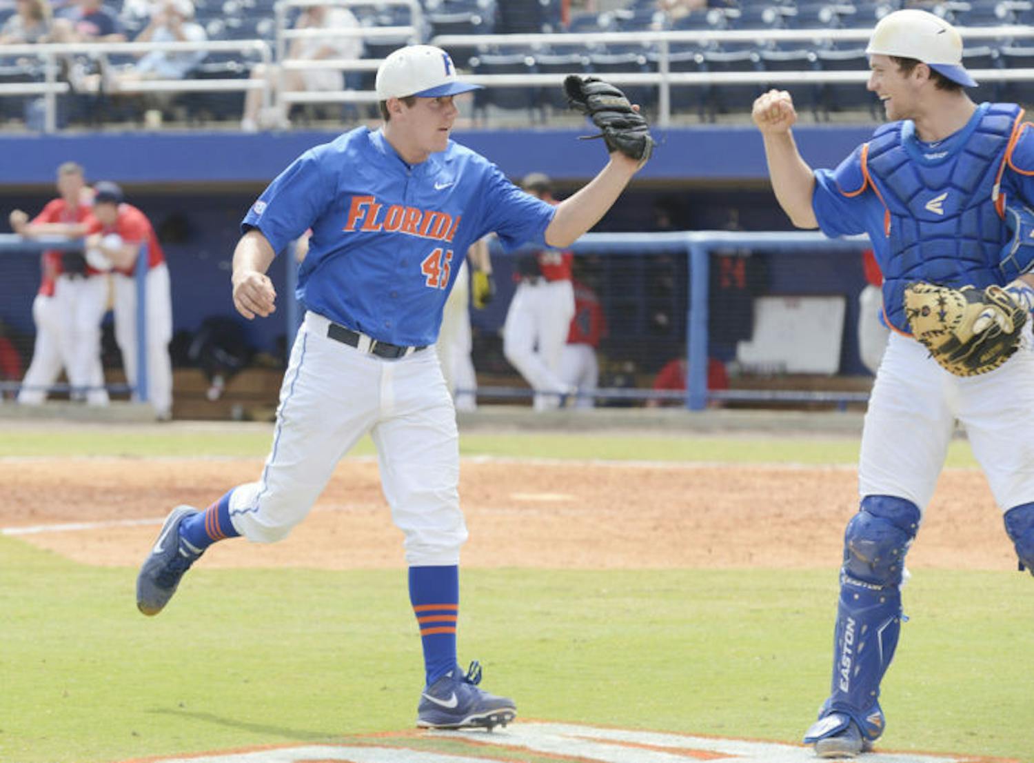 Right-handed pitcher Johnny Magliozzi (left) celebrates with catcher Taylor Gushue during Florida’s 4-0 win against Ole Miss on March 31 at McKethan Stadium.&nbsp;
