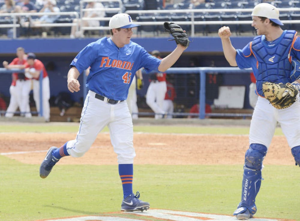 <p class="p1">Right-handed pitcher Johnny Magliozzi (left) celebrates with catcher Taylor Gushue during Florida’s 4-0 win against Ole Miss on March 31 at McKethan Stadium.&nbsp;</p>