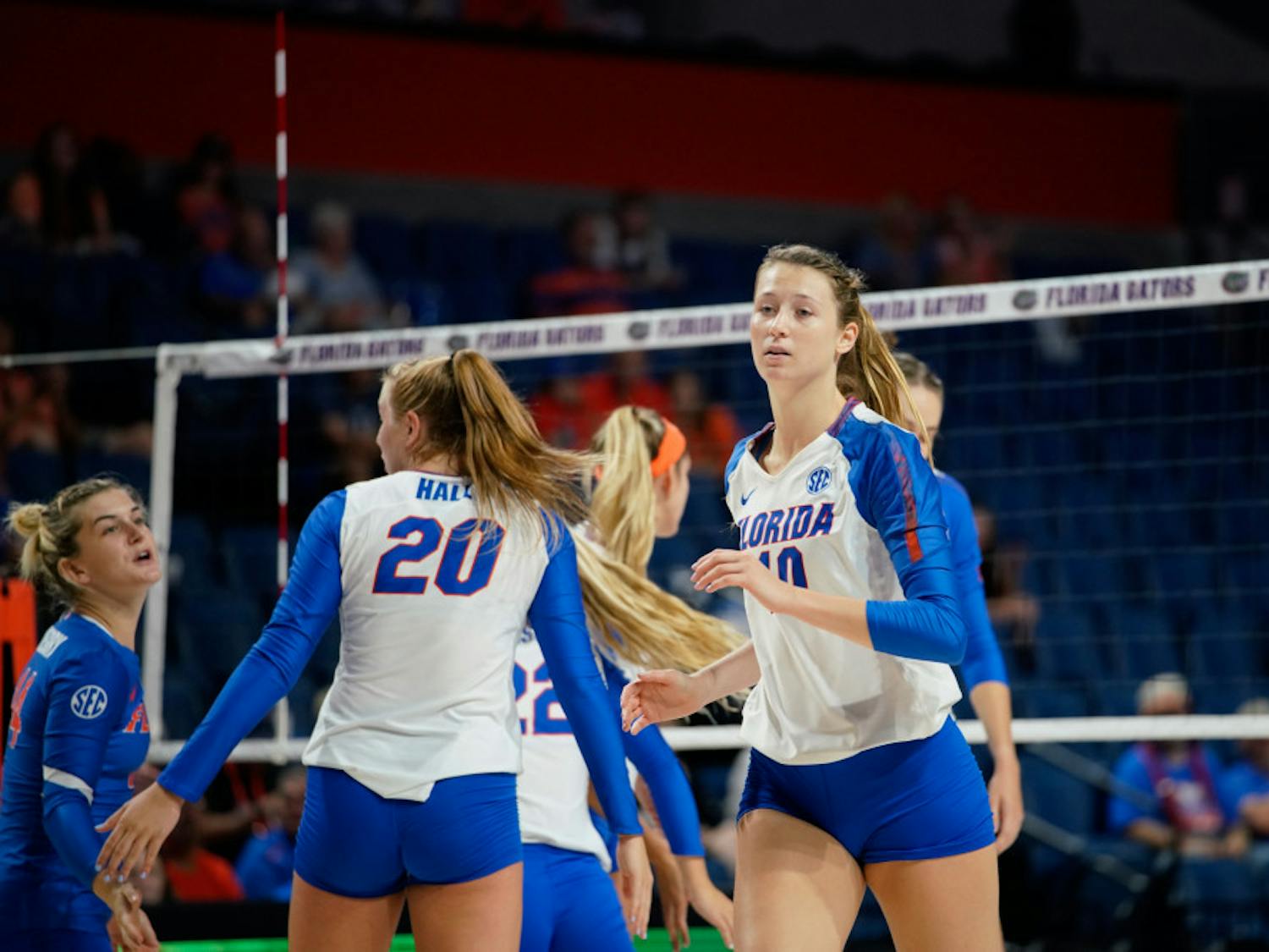 Redshirt sophomore Holly Carlton (right) was convinced by freshman Thayer Hall (middle) to transfer to the University of Florida.  