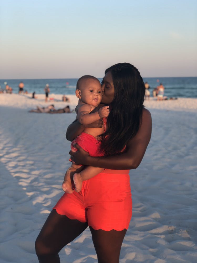 Tineka Benjamin, 19, said she and 8-month-old Princeton enjoy watching movies together and playing outside in the park. The computer science sophomore had her son during her first year at UF.