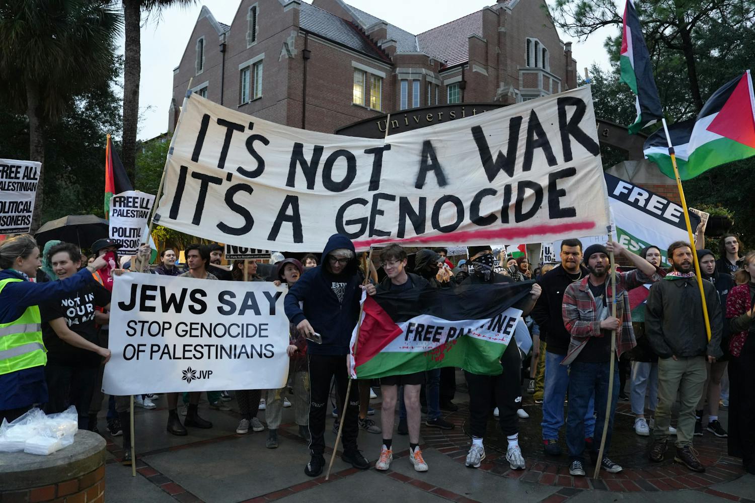 Around 60 protestors gather on the corner of University Avenue and 13th Street in support of Palestine on Thursday, Nov. 16, 2023. 