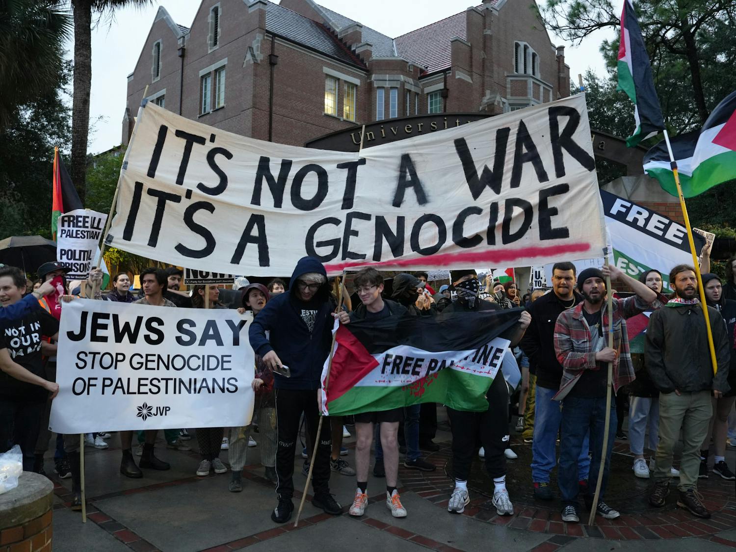 Around 60 protestors gather on the corner of University Avenue and 13th Street in support of Palestine on Thursday, Nov. 16, 2023. 