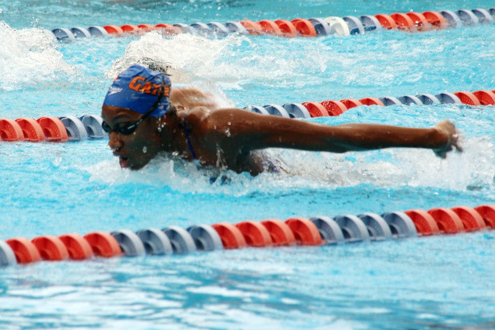 <p>Junior Natalie Hinds competes in the 100-yard butterfly during Florida's 189.5-110.5 win against Arkansas on Saturday in the O'Connell Center</p>