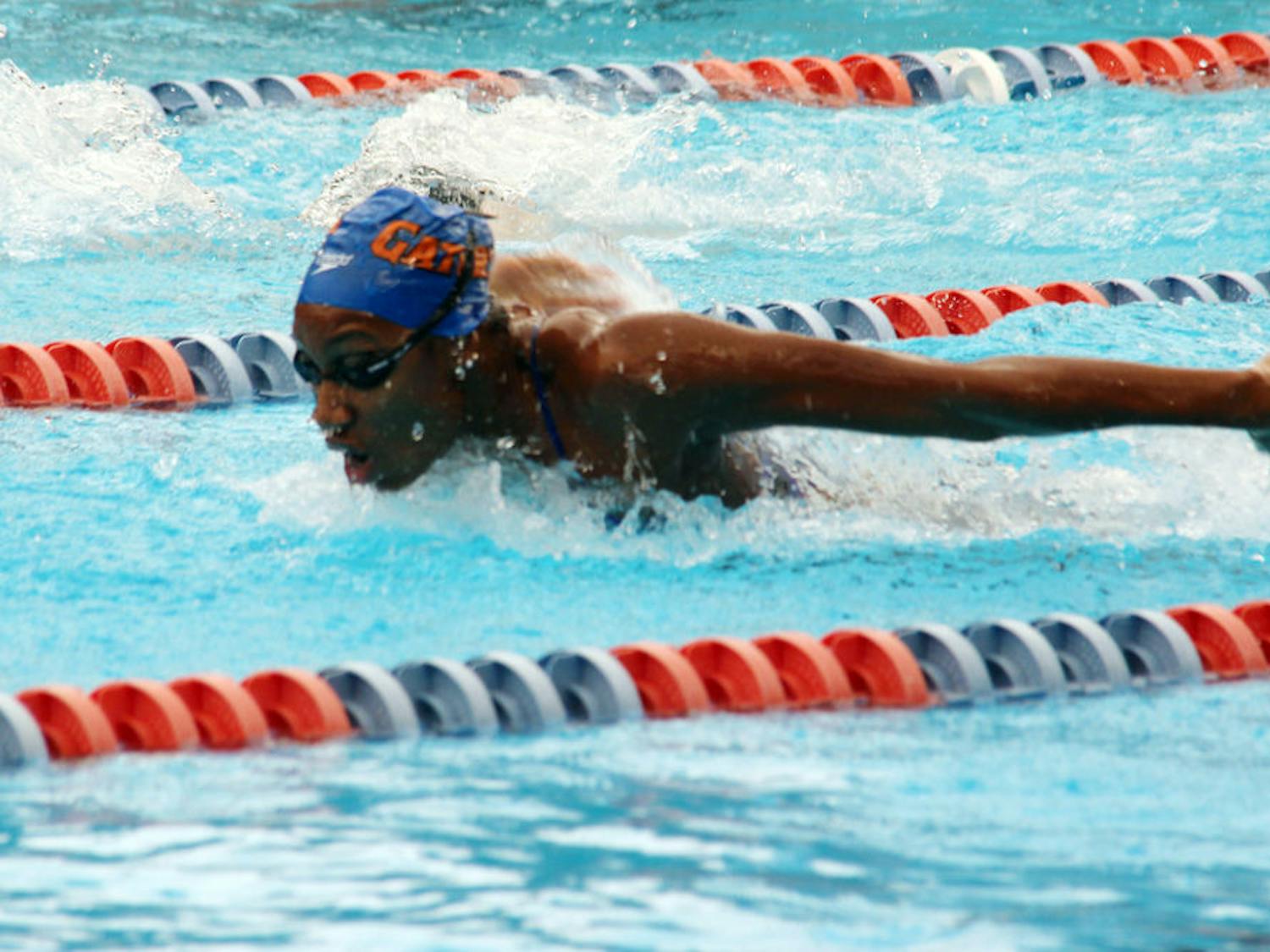 Junior Natalie Hinds competes in the 100-yard butterfly during Florida's 189.5-110.5 win against Arkansas on Saturday in the O'Connell Center