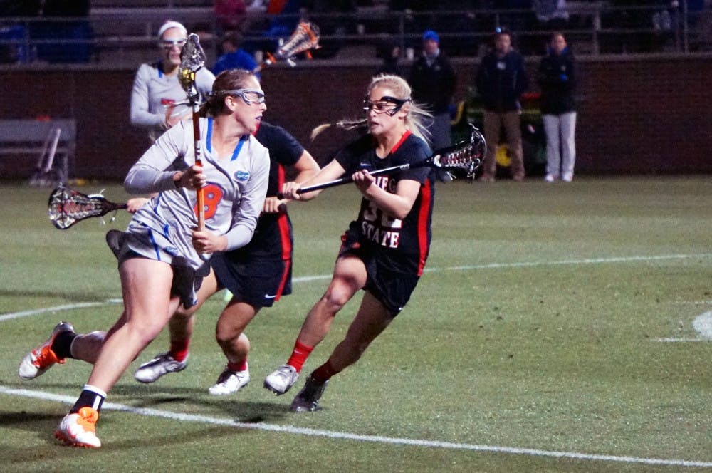 <p>Shannon Gilroy runs toward the net during Florida's win against San Diego State at Donald R. Dizney Stadium.</p>