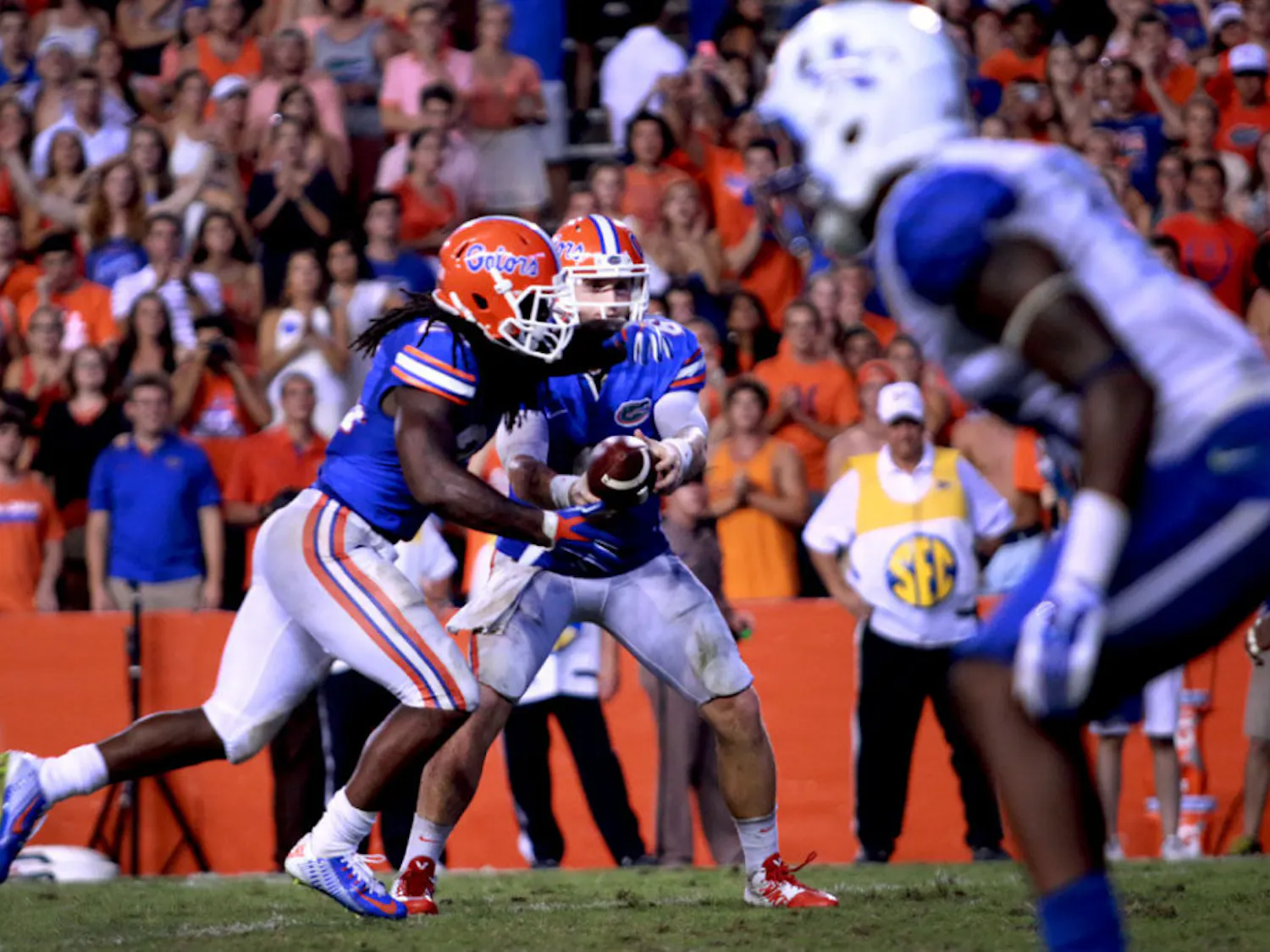 Redshirt junior quarterback Jeff Driskel hands the ball to junior running back Matt Jones during Florida's 36-30 overtime victory against Kentucky on Saturday at Ben Hill Griffin Stadium.