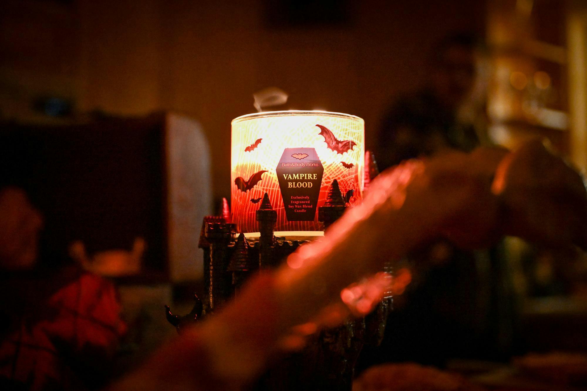 A “Vampire Blood” scented candle glows eerily at Gainesville by Night's vampire masquerade live-action role-playing game, Saturday, Jan. 31, 2026.