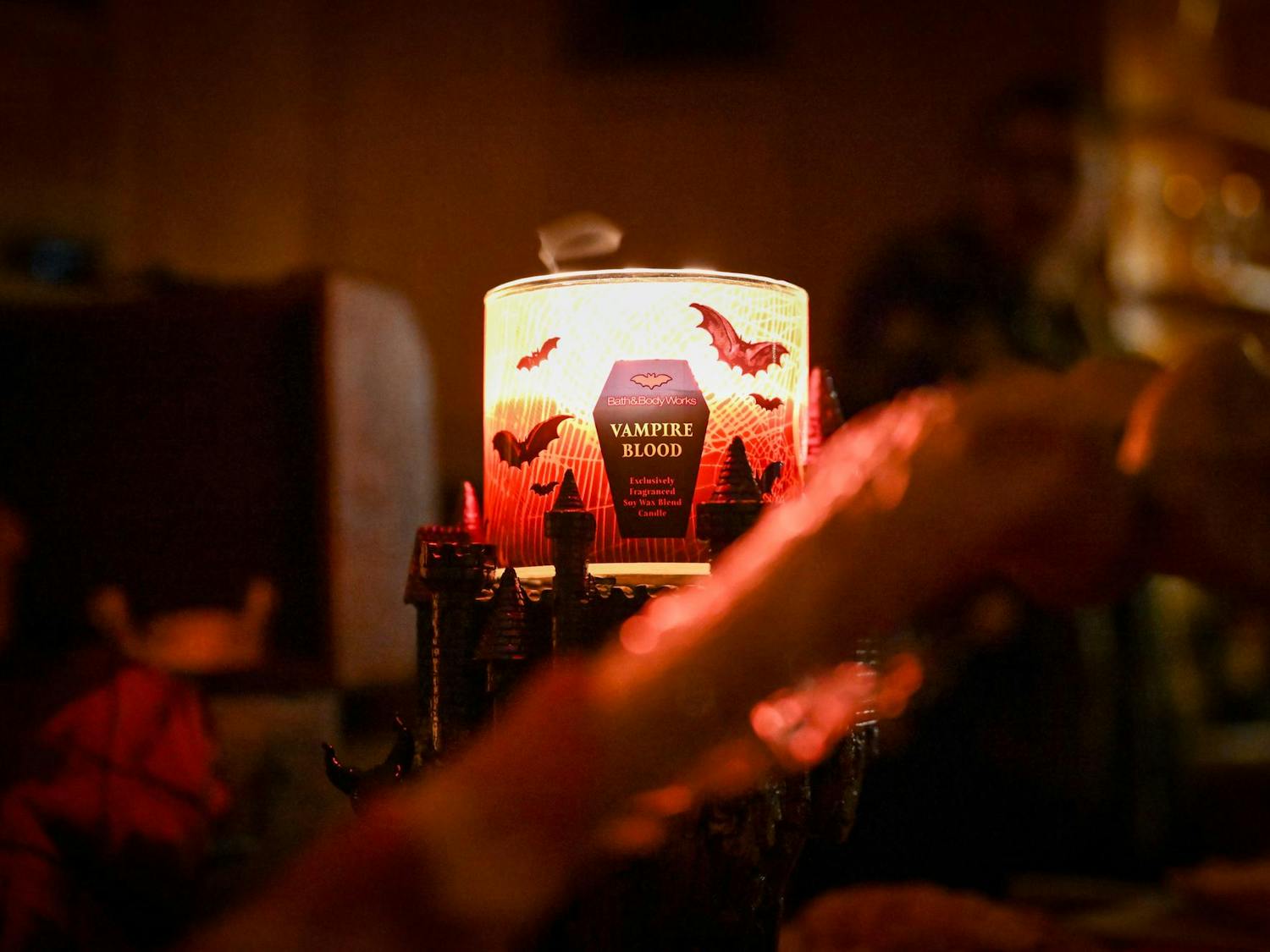 A “Vampire Blood” scented candle glows eerily at Gainesville by Night's vampire masquerade live-action role-playing game, Saturday, Jan. 31, 2026.