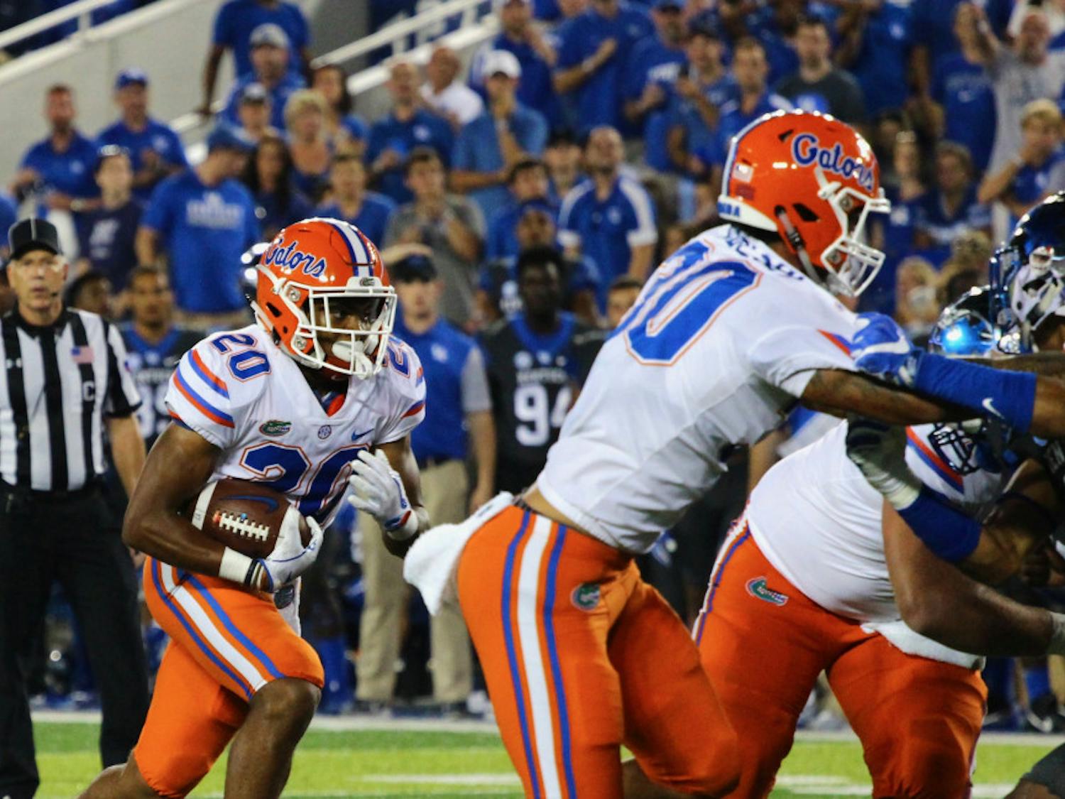 Malik Davis carries the ball during Florida's 28-27 win against Kentucky on Saturday night at Kroger Field.