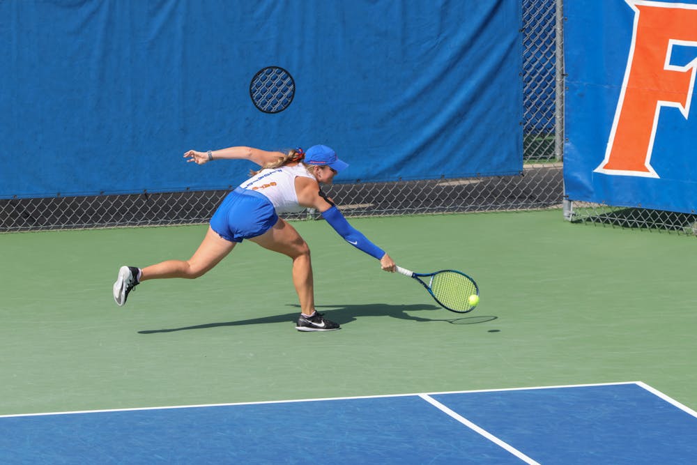 Senior Carly Briggs returns a ball in the Gators' win against the No. 3 Michigan Wolverines Wednesday, March 22, 2023.