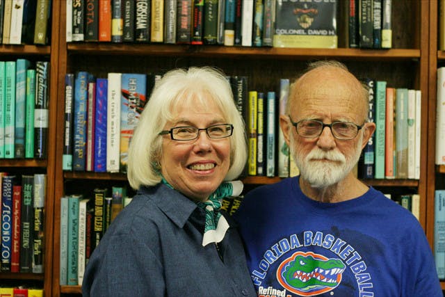 Book Lover's Cafe owners Anne Haisley, 71, and Phil Haisley, 77, pose for a photo Thursday. They have owned the Gainesville cafe, which will be closing its doors in January, since 1989.