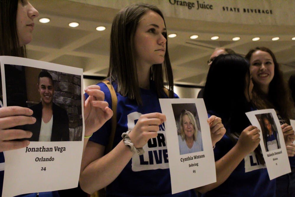 Lauren Herwitz (center), an 18-year-old UF Health Science and theater freshman and March For Our Lives Gainesville member, protests Florida Senate Bill 7030, which would allow teachers to carry firearms in case of an active shooter, Wednesday afternoon. “I’m almost in tears, this is just incredibly powerful and emotional," she said.
