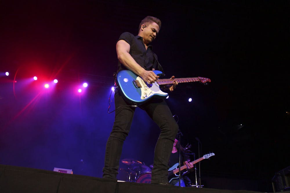 <p>Hunter Hayes performs at the Stephen C. O’Connell Center on Wednesday night, opening with his song “Tattoo.”</p>