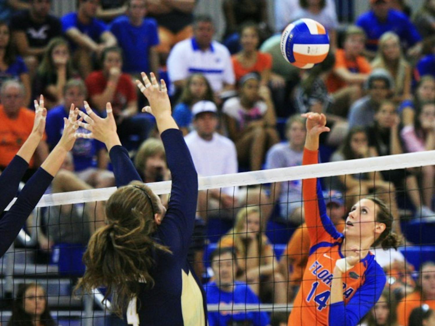 Middle blocker Betsy Smith (14) spikes the ball against Georgia Tech in a 3-1 victory on Sept. 8. The senior led the Gators with a season-high 11 blocks in Florida's sweep of Arkansas on Friday night.