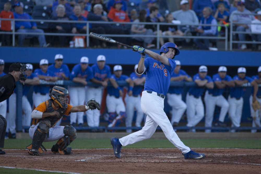 <p>UF infielder Christian Hicks swings at a pitch during Florida's 3-2 loss against Tennessee on April 8, 2017, at McKethan Stadium.</p>