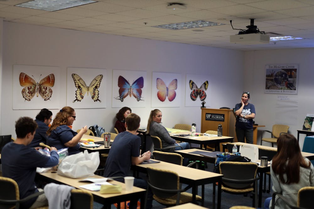 <p>Alachua County and UF student teachers sit during a discussion held by Stephanie Killingsworth on the second day of the Chewing on Change professional workshop at the Florida Museum of Natural History Sunday, Oct. 23, 2022.</p>