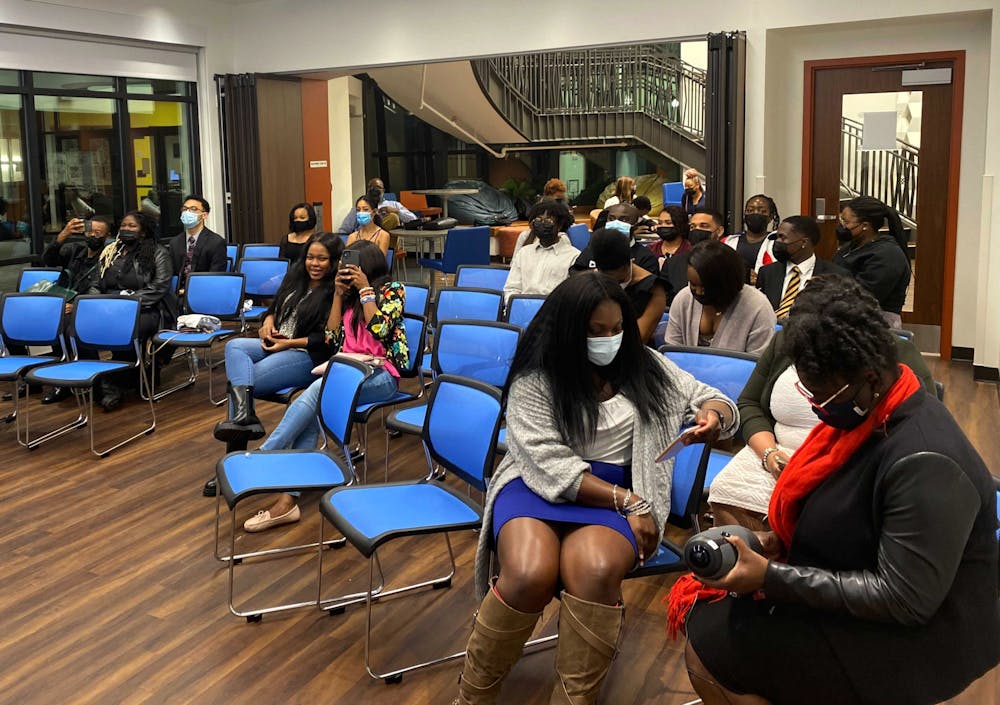 UF students, faculty and Black Student Union members wait for the Black History Month opening ceremony to begin at the Institute of Black Culture on Tuesday, Feb. 1.
