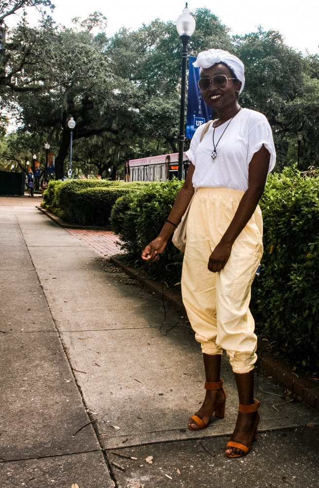 Juana Viel, 18, wears pastel pants while power-walking to class in heels a 100 degree heat index without breaking a sweat.