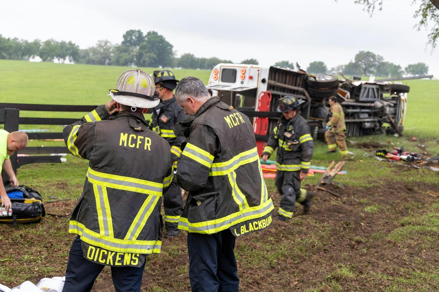 Two Marion County Fire Rescue firefighters respond to a bus crash on West Highway 40 outside Ocala on Tuesday May 14, 2024.