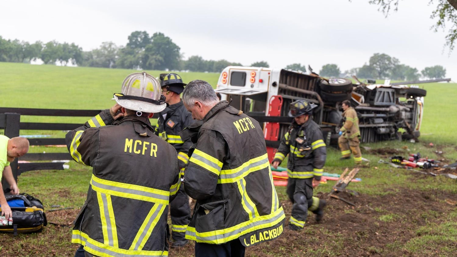 Two Marion County Fire Rescue firefighters respond to a bus crash on West Highway 40 outside Ocala on Tuesday, May 14, 2024.