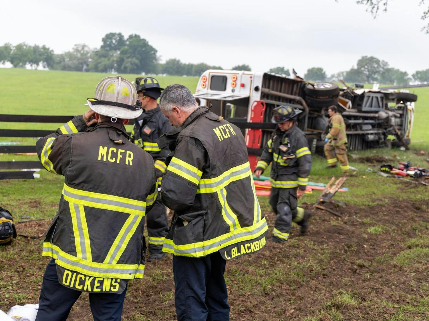Two Marion County Fire Rescue firefighters respond to a bus crash on West Highway 40 outside Ocala on Tuesday, May 14, 2024.