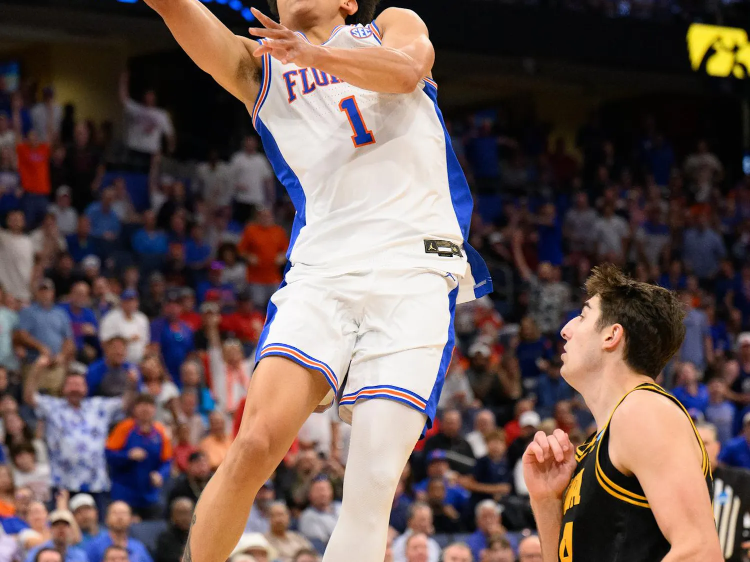 Florida guard Xaivian Lee (1) shoots a layup during the first half of an NCAA Tournament second round game against Iowa, Sunday, March 22, 2026, in Tampa, Fla.