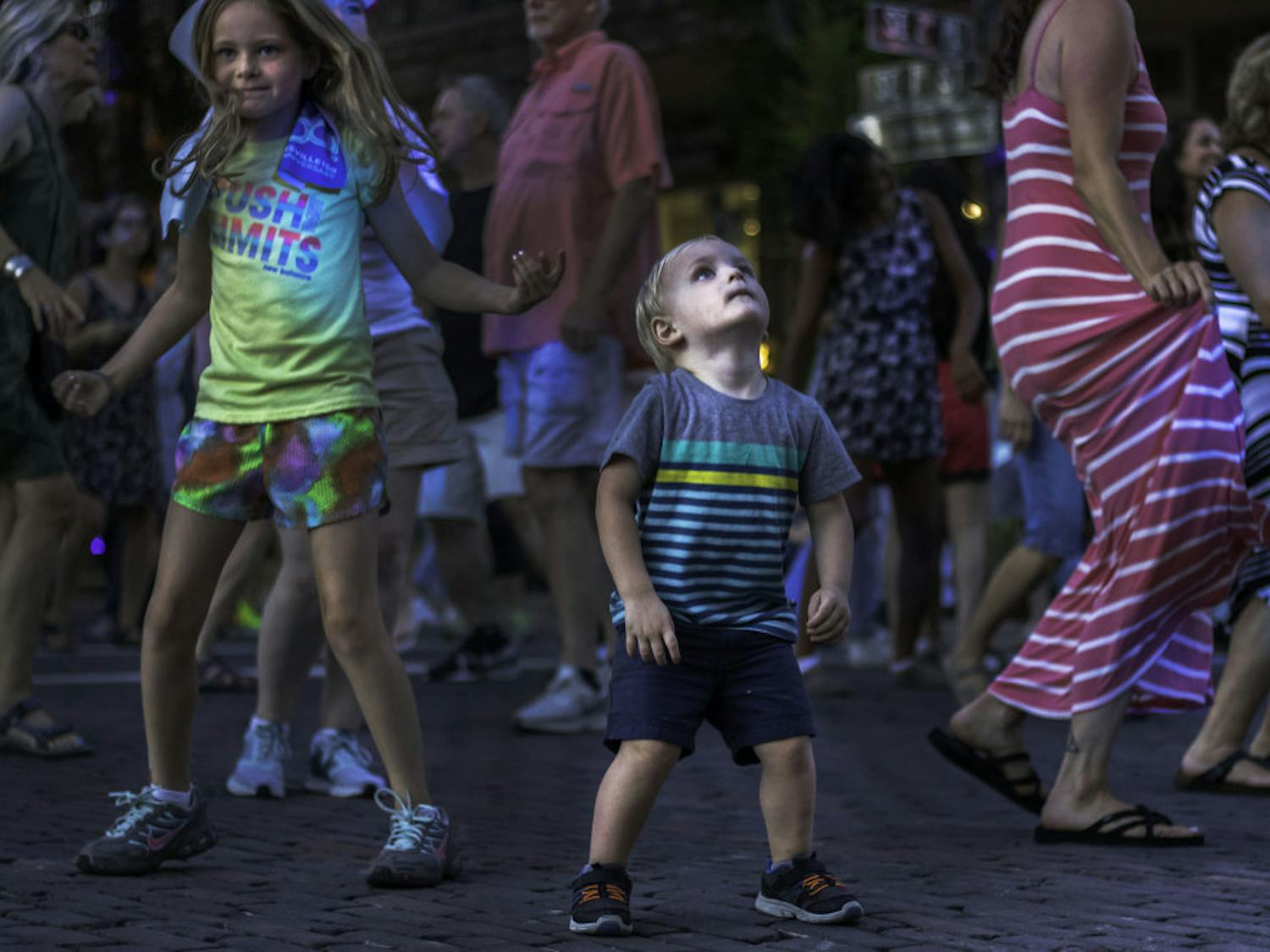 The plaza in front of the Hippodrome Theatre was transformed into a block party Saturday evening when the City of Gainesville hosted the Summer in the City Downtown Dance Party. Over 650 people of all ages attended the event, which had music from a DJ, food trucks, vendors and refreshments. Summer in the City was sponsored by Gainesville Health and Fitness and organized as a part of Gainesville150!, a yearlong celebration of the 150th anniversary of the city. Nicole Yucht, the project coordinator for Gainesville150!, said the organizers plan to hold a large event every three months during the celebration and that the next big event will be in early November. “Music and dancing brings people together,” Yucht said. “And so that’s what we really wanted to do.”