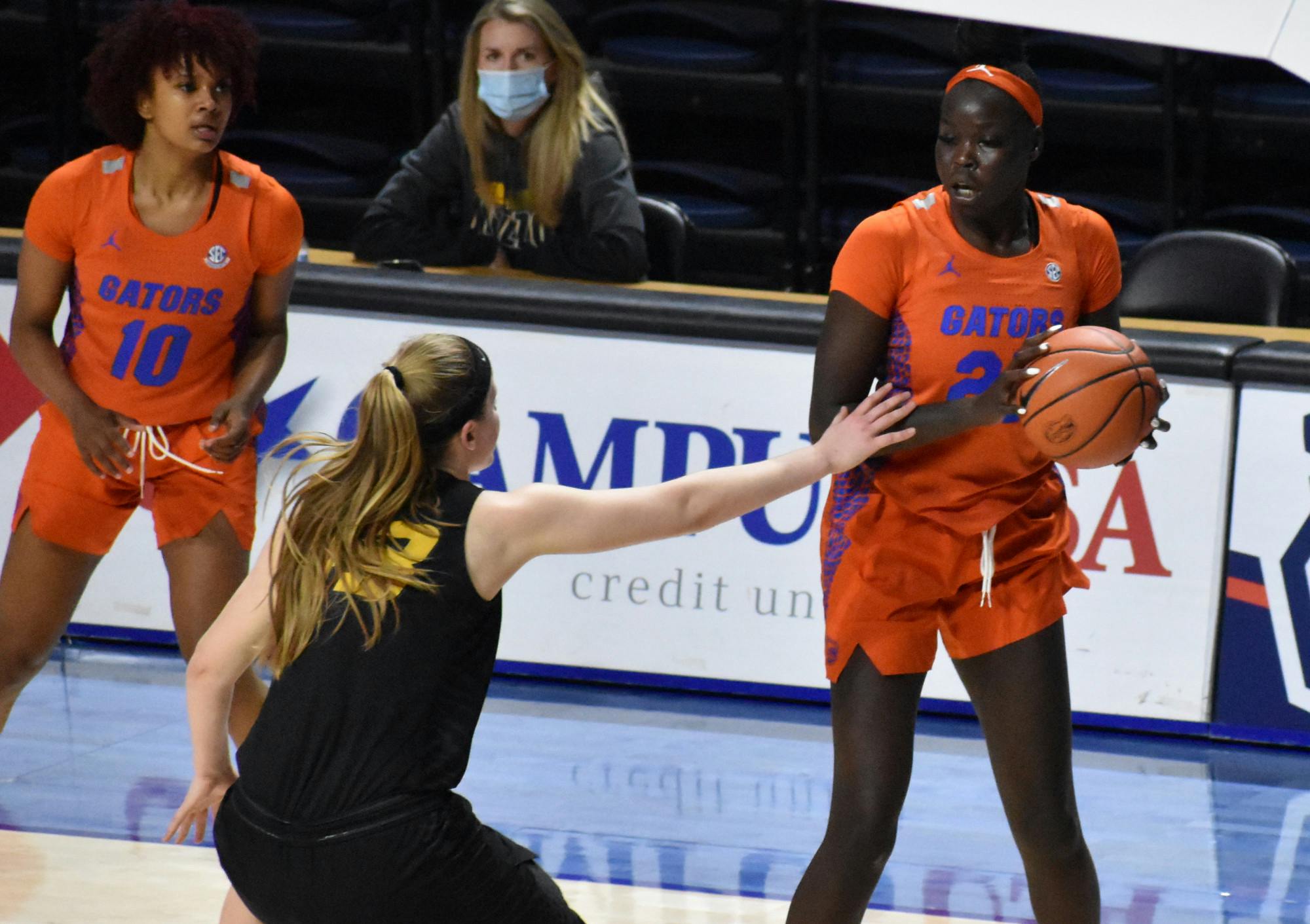 Florida forward Faith Dut sizes up a Missouri defender on Feb. 11, 2021. Dut scored 12 points and grabbed five rebounds in just 22 minutes Thursday as the Gators fell by 18 against Ole Miss. 