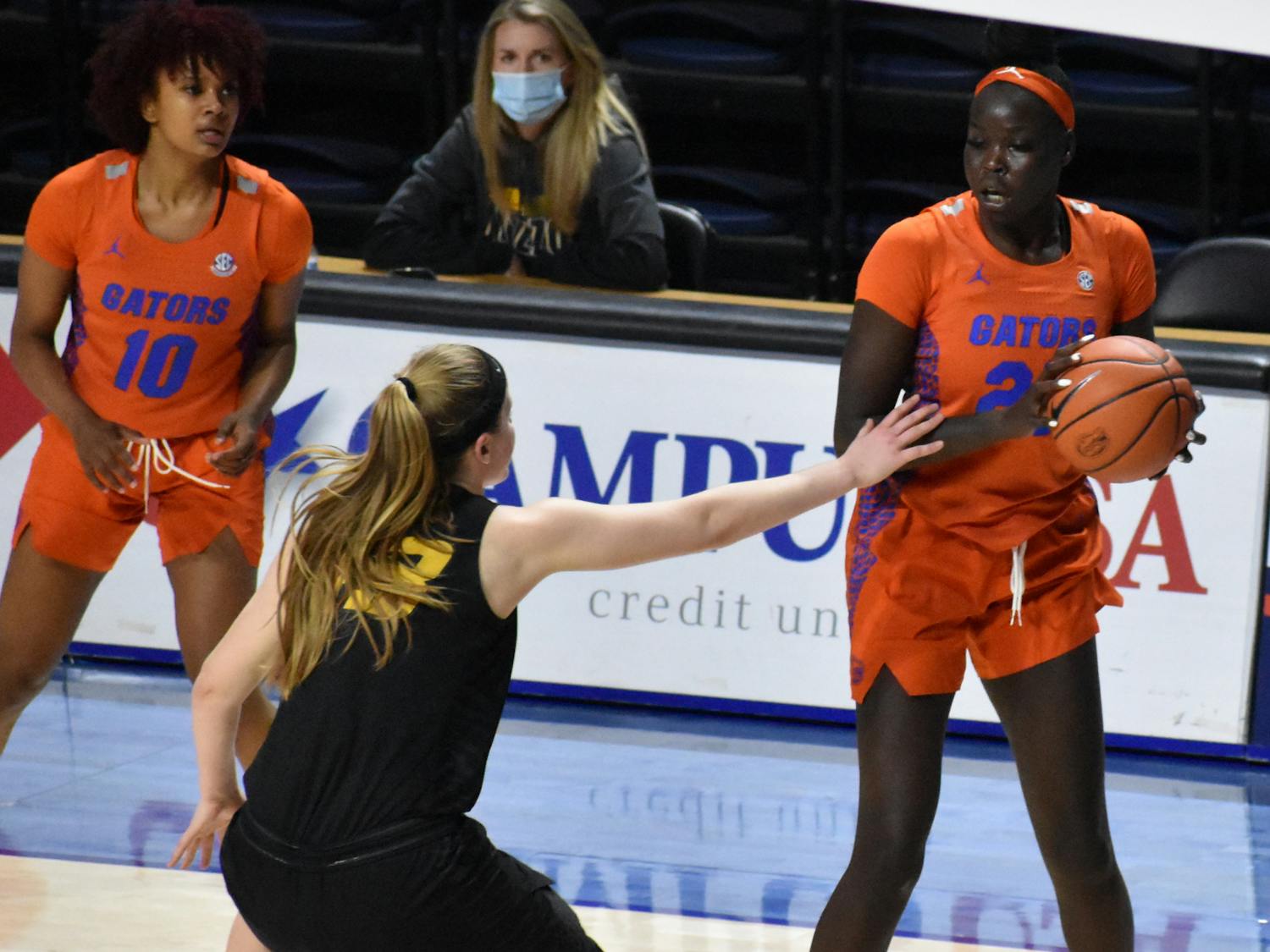 Florida forward Faith Dut sizes up a Missouri defender on Feb. 11, 2021. Dut scored 12 points and grabbed five rebounds in just 22 minutes Thursday as the Gators fell by 18 against Ole Miss. 
