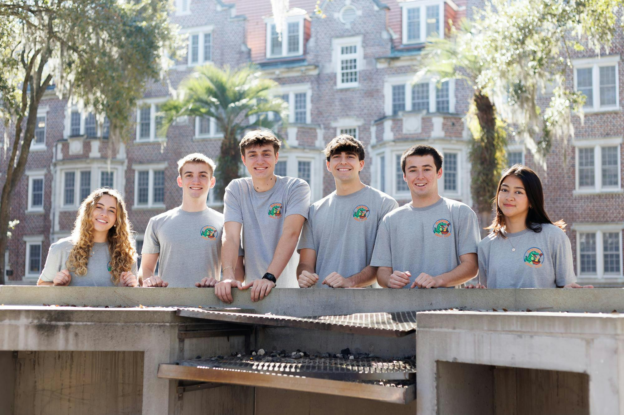 Members of the Gator Grill Club executive board are pictured by a grill on the University of Florida campus, Tuesday, Feb. 10, 2026.