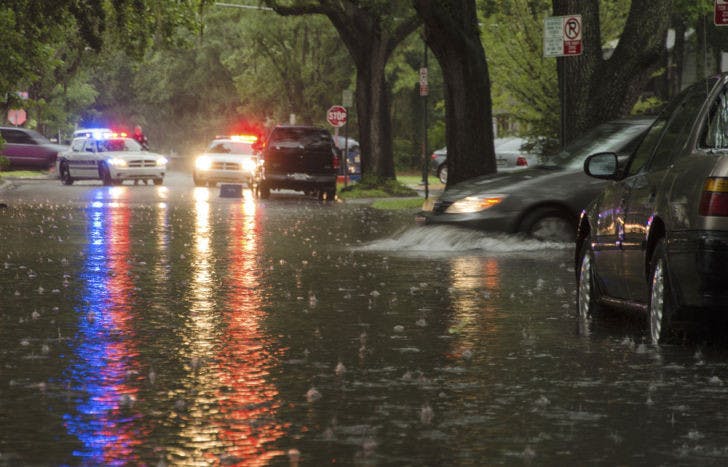A car pulls into floodwaters on Southwest First Avenue on Wednesday. The street was partially closed by police to prevent cars from stalling in deep water from Wednesday’s storms.&nbsp;
&nbsp;
