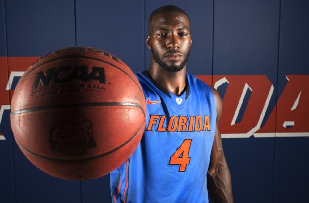 <p>Junior Patric Young poses for a picture during basketball media day on Wednesday. Due to an added year of experience, the center is expected to play more minutes this season.</p>