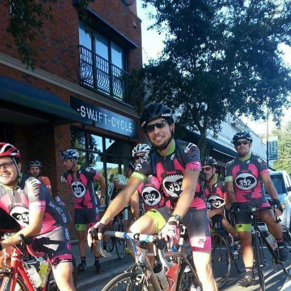 Bicyclists ride along West University Avenue as part of the Gainesville-Atlantic 75 bicycle race in September 2015.